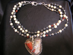 This necklace bead weaving entitled Stories From the Heart is an early work of Mary Ellen Beads Albuquerque and showcases heART centered creativity.